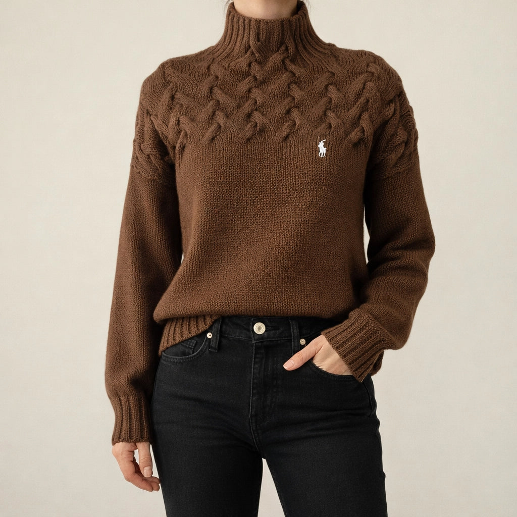 Pull noir à col montant en maille torsadée